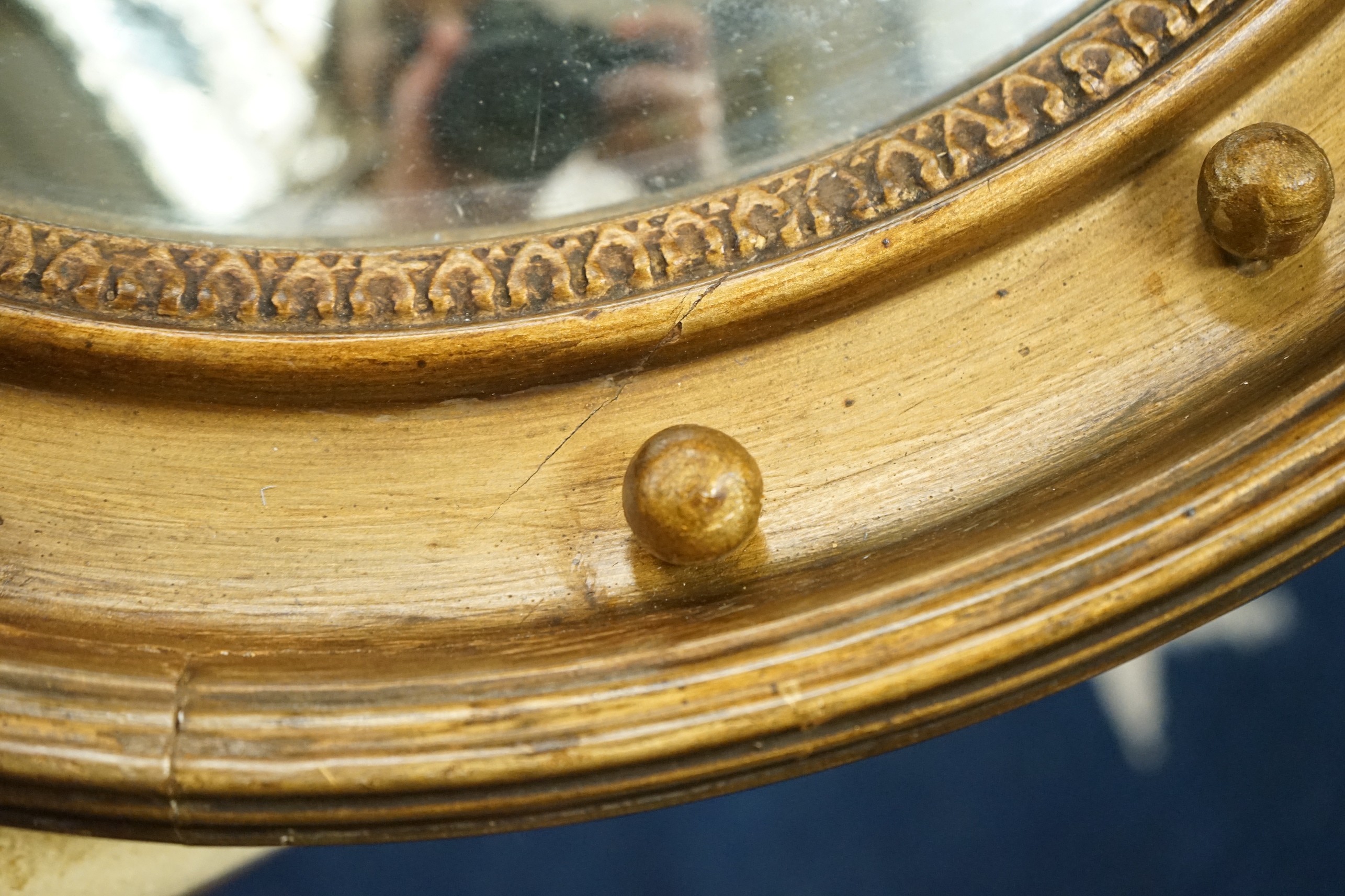 A Regency convex wall mirror, diameter 56cm